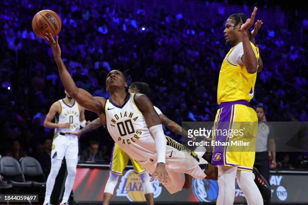 Bennedict Mathurin of the Indiana Pacers shoots the ball after being fouled by Cam Reddish of the Los Angeles Lakers during the fourth quarter in the...