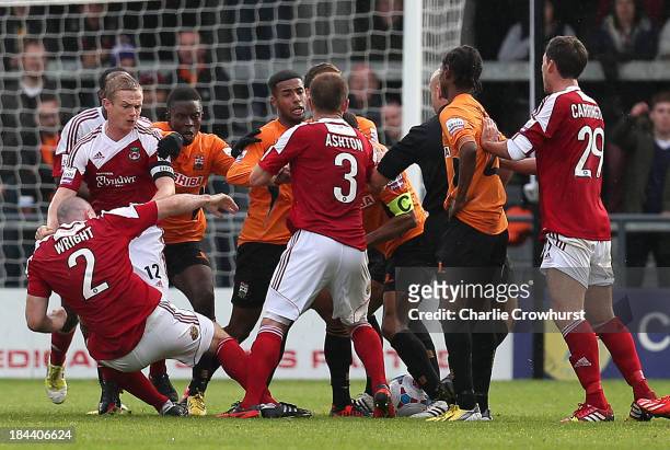 Stephen Wright of Wrexham falls to the floor after being elbowed in the face by Barnet player manager Edgar Davids during the Skrill Conference...