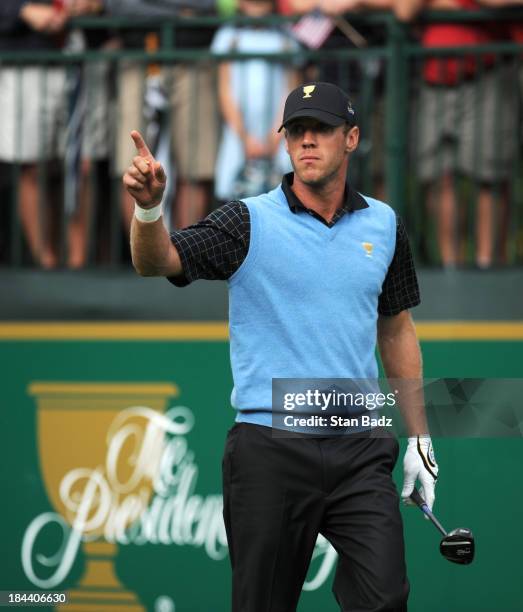 Graham DeLaet of the International Team hits a shot on the first hole during the Final Round Singles Matches of The Presidents Cup at the Muirfield...