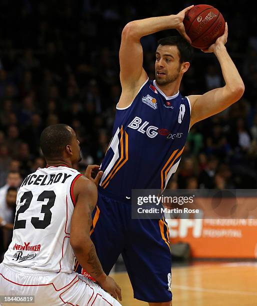 Immanuel McElroy of Braunschweig and Philip Zwiener of Bremerhaven compete for the ball during the Beko Basketball Bundesliga match between New...