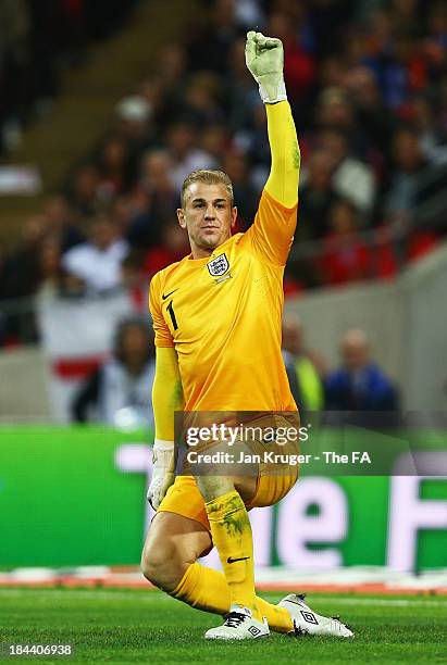 Goalkeeper Joe Hart of England gestures during the FIFA 2014 World Cup Qualifying Group H match between England and Montenegro at Wembley Stadium on...