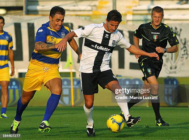 Benito Carbone of Stelle Crociate competes for the ball with Fabio Cannavaro of Stelle Gialloblu during the 100 Years Anniversary match between...