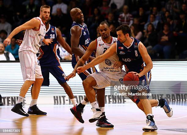 Immanuel McElroy of Braunschweig and Philip Zwiener of Bremerhaven compete for the ball during the Beko Basketball Bundesliga match between New...