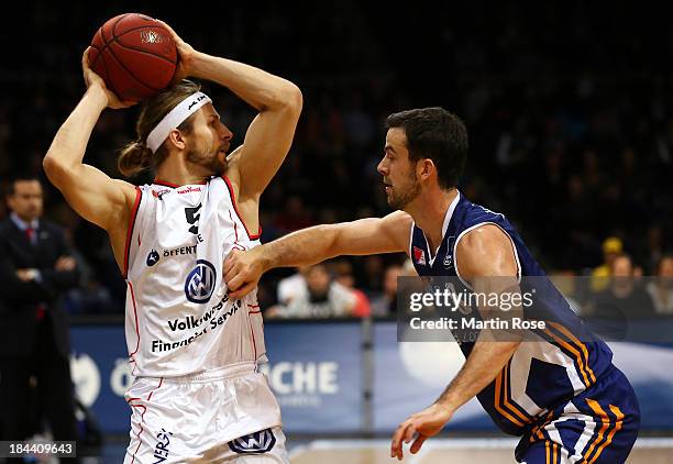 Robert Kulawick of Braunschweig and Philip Zwiener of Bremerhaven compete for the ball during the Beko Basketball Bundesliga match between New Yorker...