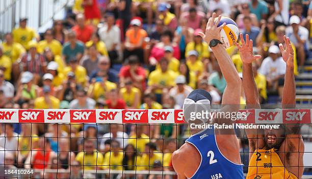 Casey Jennings of United States and Pedro Salgado of Brazil in action during day six of the FIVB Beach Volleyball Sao Paulo Grand Slam 2013 at Parque...