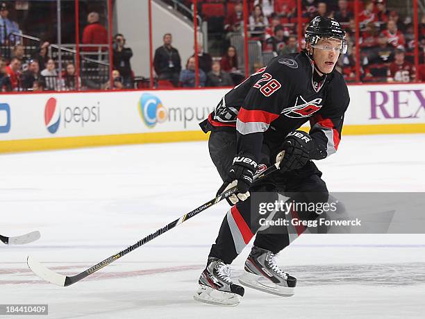 Alexander Semin of the Carolina Hurricanes skates for the puck during an NHL game against the Phoenix Coyotes at PNC Arena on October 13, 2013 in...