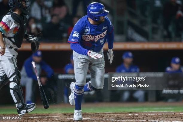 José Rojas of Charros suelta el bate y corre a primera base en la tercera entrada during the game between Charros de Jalisco and Naranjeros de...