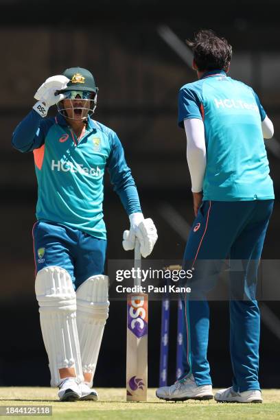 David Warner shares a moment with Mitchell Starc during an Australian nets session the at the WACA on December 10, 2023 in Perth, Australia.