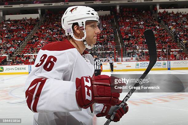 Rob Klinkhammer of the Phoenix Coyotes gets the game-winning goal during an NHL game against the Carolina Hurricanes at PNC Arena on October 13, 2013...