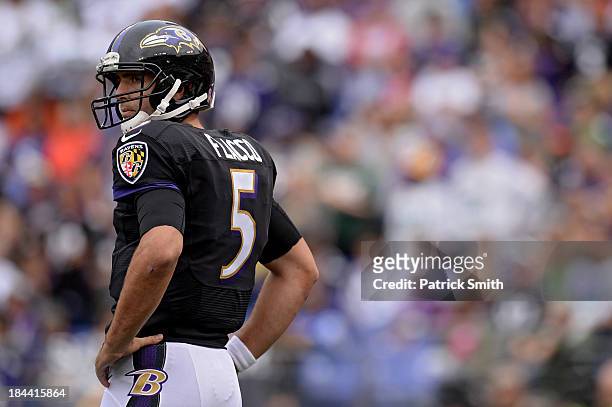 Quarterback Joe Flacco of the Baltimore Ravens looks on after a penalty was called on the offense against the Green Bay Packers in the third quarter...