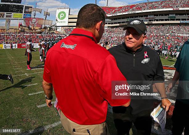 Tampa Bay Buccaneers head coach Greg Schiano shakes hands with Philadelphia Eagles head coach Chip Kelly following a game at Raymond James Stadium on...