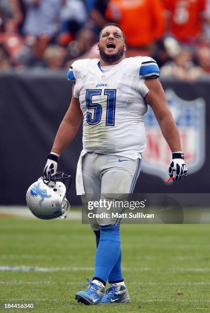 Center Dominic Raiola of the Detroit Lions celebrates a touchdown as he walks off the field against the Cleveland Browns at FirstEnergy Stadium on...