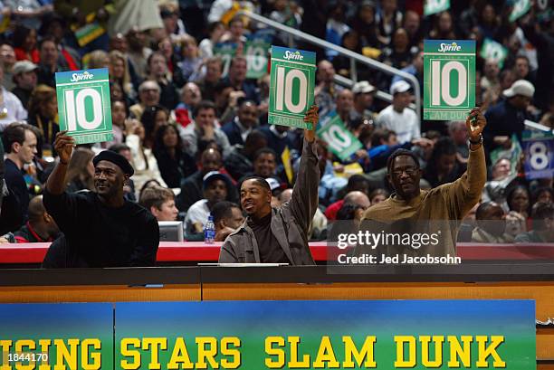 Michael Jordan, Anthony "Spud" Webb, and Dominique Wilkins judge the Sprite Rising Stars Slam Dunk Contest during the 2003 NBA All-Star Weekend at...