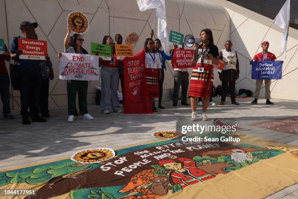 Activists protest for human rights and climate justice on day ten of the UNFCCC COP28 Climate Conference at Expo City Dubai on December 10, 2023 in...