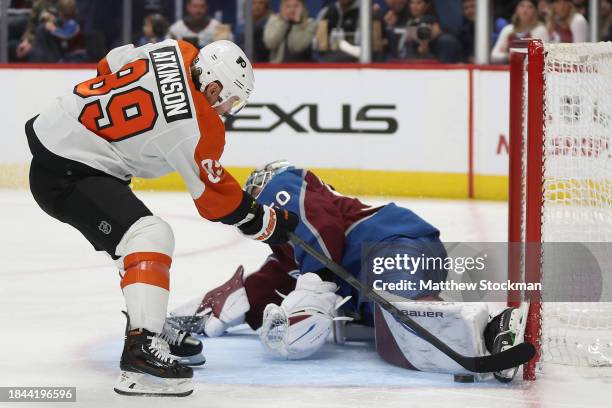 Goalie Ivan Prosvetov of the Colorado Avalanche saves a shot on goal by Cam Atkinson of the Philadelphia Flyers in the third period at Ball Arena on...