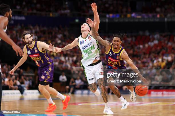 Mitchell Creek of the Phoenix collides with Jaylen Adams of the Kings as he drives to the basket during the round 10 NBL match between Sydney Kings...