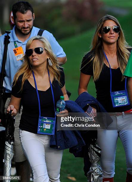 Amy Mickelson, wife of Phil Mickelson with Jillian Stacey, girlfriend of Keegan Bradley of the U.S. Team follow the play during the Day One Four-Ball...