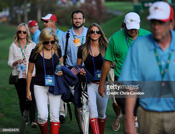 Amy Mickelson, wife of Phil Mickelson with Jillian Stacey, girlfriend of Keegan Bradley of the U.S. Team follow the play during the Day One Four-Ball...