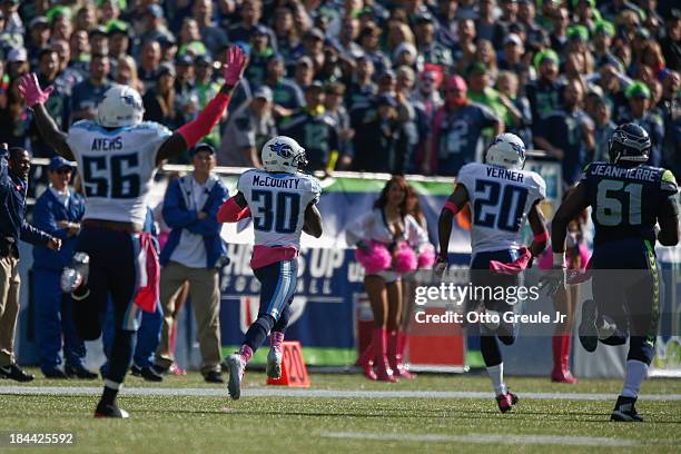 Cornerback Jason McCourty of the Tennessee Titans returns a fumble 77 yards for a touchdown in the second quarter against the Seattle Seahawks at...