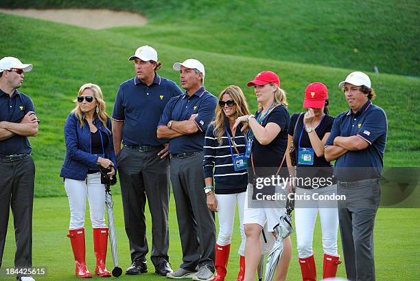 Zach Johnson, Amy Mickelson, Phil Mickelson, U.S. Team captain Fred Couples, Nadine Moze, Kim Johnson, Amanda Dufner and Jason Dufner of the U.S....