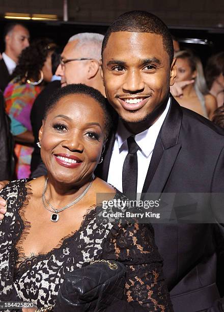 Singer Trey Songz and his grandmother arrive at the Los Angeles premiere of 'Baggage Claim' on September 25, 2013 at Regal Cinemas L.A. Live in Los...