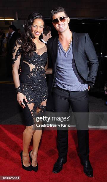 Actress Paula Patton and singer Robin Thicke arrive at the Los Angeles premiere of 'Baggage Claim' on September 25, 2013 at Regal Cinemas L.A. Live...