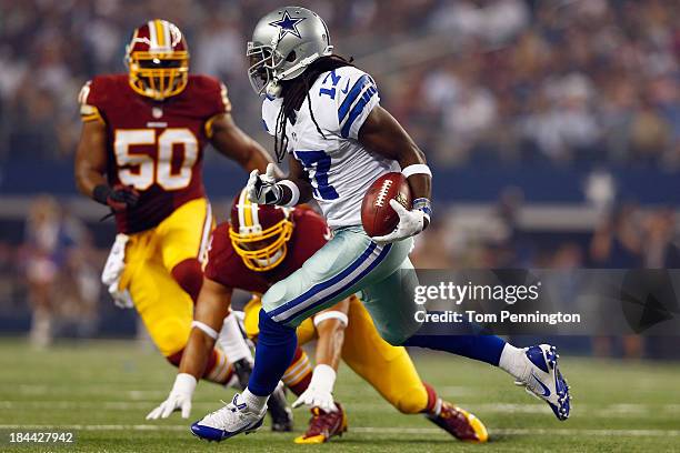 Dwayne Harris of the Dallas Cowboys beats out Bryan Kehl of the Washington Redskins and Rob Jackson of the Washington Redskins to score a touchdown...