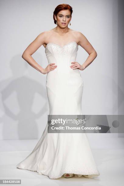 Model walks the runway at the Matthew Christopher Couture Fall 2014 Bridal collection show at the Hilton New York on October 13, 2013 in New York...