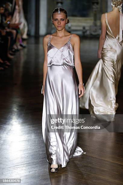 Model walks the runway at the Johanna Johnson Fall 2014 Bridal collection show on October 13, 2013 in New York City.