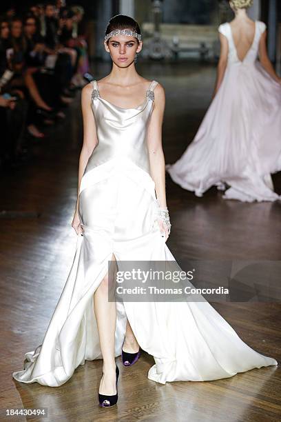 Model walks the runway at the Johanna Johnson Fall 2014 Bridal collection show on October 13, 2013 in New York City.