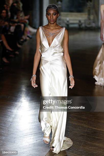 Model walks the runway at the Johanna Johnson Fall 2014 Bridal collection show on October 13, 2013 in New York City.