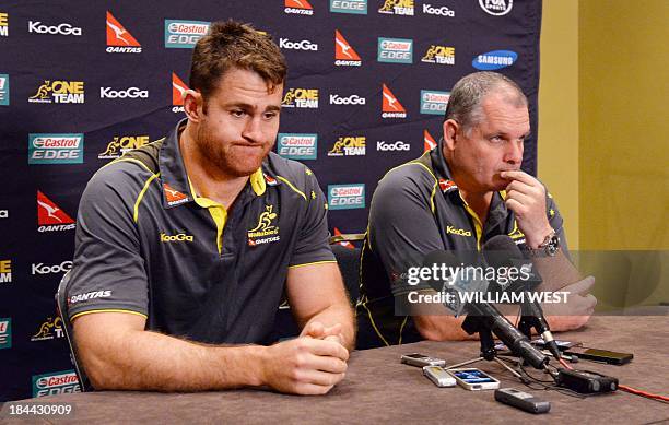 Australian Wallabies rugby union coach Ewen McKenzie and captain James Horwill attend a press conference in Sydney on October 14 as the team prepares...