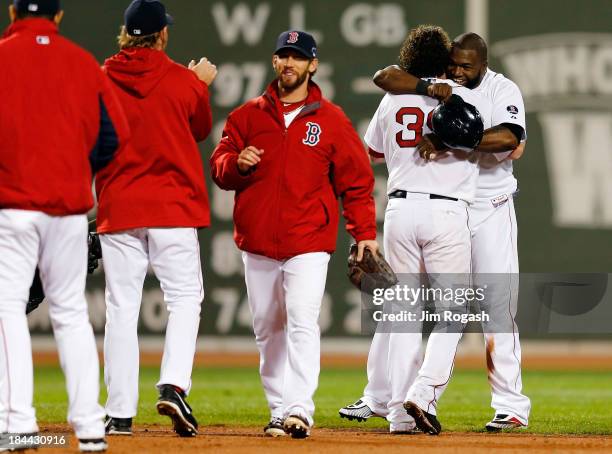 David Ortiz celebrates with Jarrod Saltalamacchia of the Boston Red Sox after defeating the Detroit Tigers 6-5 in Game Two of the American League...