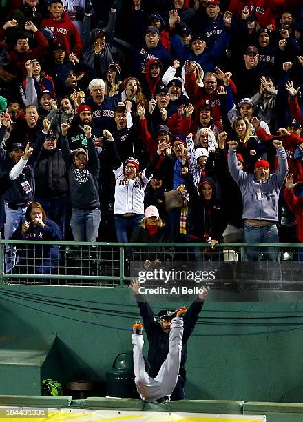 Torii Hunter of the Detroit Tigers is unable to catch a grand slam hit by David Ortiz of the Boston Red Sox in the eighth inning as Boston police...