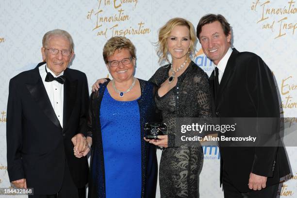 Alfred E. Mann, Claudia Mann, Janet Gretzky, and Wayne Gretzky attend the 10th annual Alfred Mann Foundation Gala at 9900 Wilshire Blvd on October...