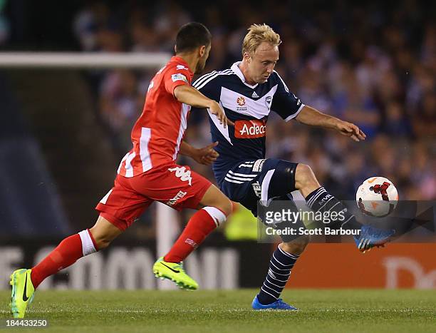 Mitch Nichols of the Victory passes the ball during the round one A-League match between the Melbourne Victory and the Melbourne Heart at Etihad...