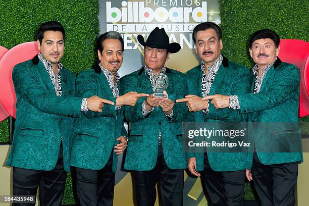 Luis Hernandez, Hernan Hernandez, Jorge Hernandez, Eduardo Hernadez and Oscar Lara of Los Tigres del Norte display their award at the 2013 Billboard...