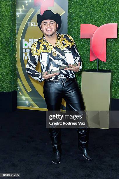 Singer Gerardo Ortiz displays his awards at the 2013 Billboard Mexican Music Awards Press Room at Dolby Theatre on October 9, 2013 in Hollywood,...