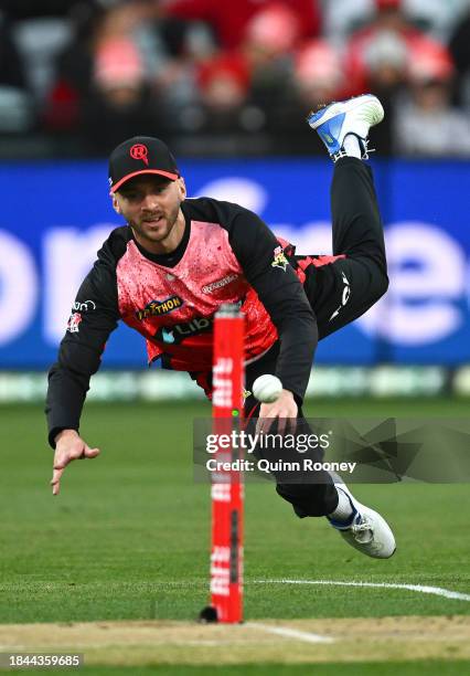 Joe Clarke of the Renegades attempts a run out during the BBL match between Melbourne Renegades and Perth Scorchers at GMHBA Stadium, on December 10...