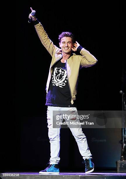 Louis Vecchio of the band New Politics performs onstage during "The Truth About Love" tour held at Staples Center on October 13, 2013 in Los Angeles,...