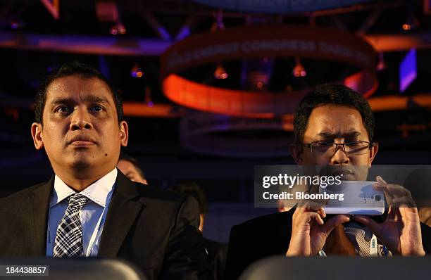 An attendee takes a photograph using a Samsung Electronics Co. Mobile device at the 22nd World Energy Congress in Daegu, South Korea, on Monday, Oct....