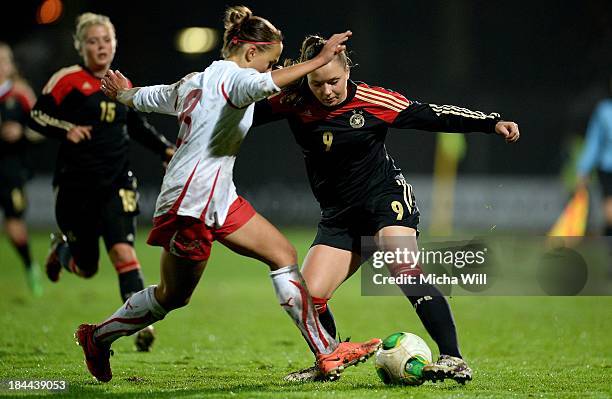 Charlotte Mayland of Switzerland challenges Laura Widak of Germany during the U17 Girls Euro Qualifier between Germany and Switzerland at...