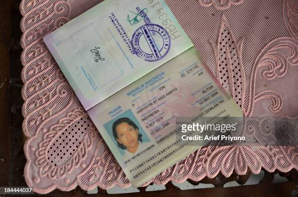 The passport of a former migrant worker, called Haryatin, who is blind after her employers abused her while working in Saudi Arabia. According to the...