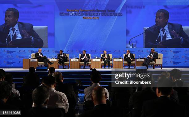 Brian Dames, chief executive officer of Eskom Holdings SOC Ltd., second from left, speaks as Karl Rose, senior director of scenarios and policies at...