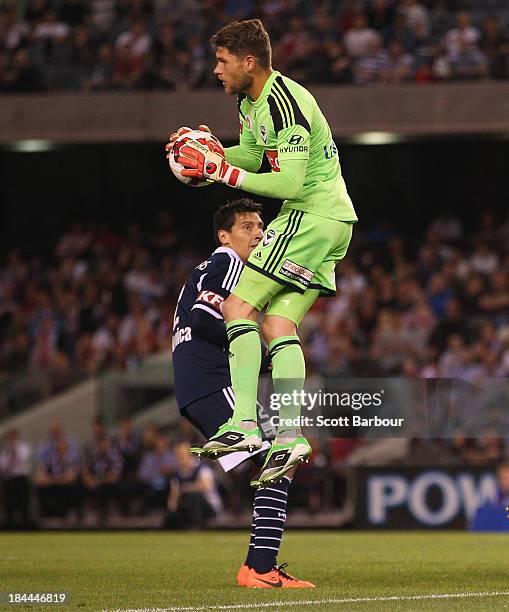 Victory goalkeeper Nathan Coe makes a save during the round one A-League match between the Melbourne Victory and the Melbourne Heart at Etihad...