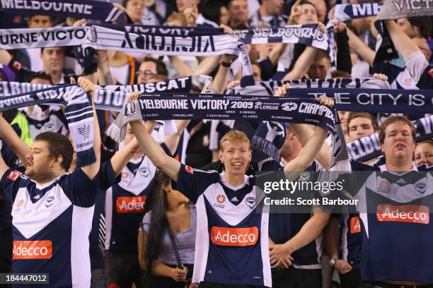 Victory fans sing during the round one A-League match between the Melbourne Victory and the Melbourne Heart at Etihad Stadium on October 12, 2013 in...