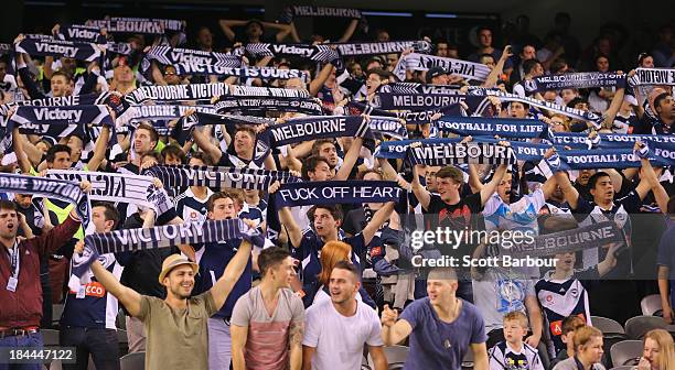 Victory fans sing during the round one A-League match between the Melbourne Victory and the Melbourne Heart at Etihad Stadium on October 12, 2013 in...