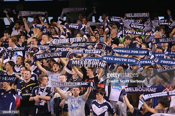 Victory fans sing during the round one A-League match between the Melbourne Victory and the Melbourne Heart at Etihad Stadium on October 12, 2013 in...