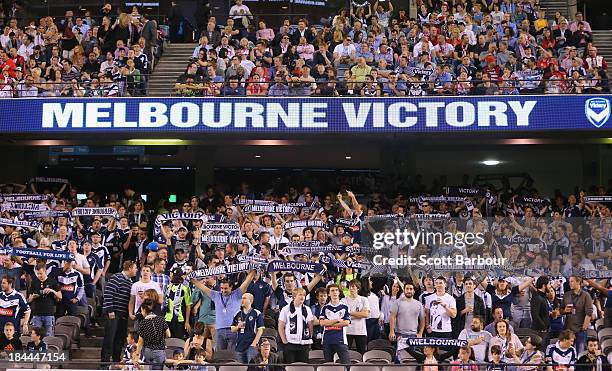 Victory fans sing during the round one A-League match between the Melbourne Victory and the Melbourne Heart at Etihad Stadium on October 12, 2013 in...