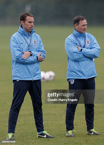 Head Coach Gareth Southgate and Assistant Coach Steve Holland look on during an England U21 training session at Colchester United Training Ground on...